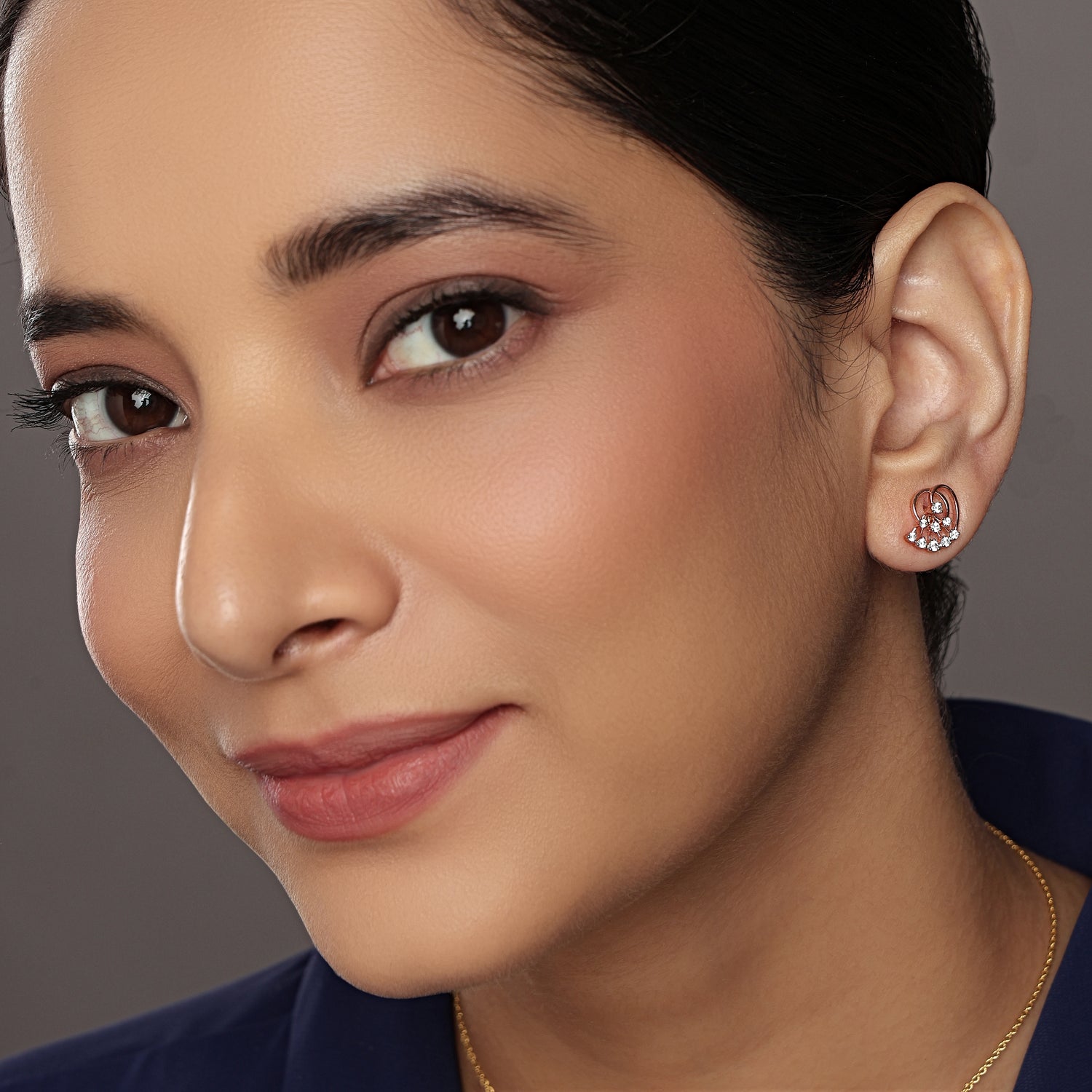 Radiant Fan Motif Stud Earrings with Layered Elegance