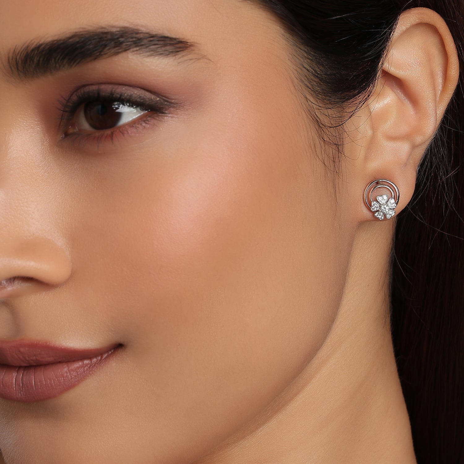 Graceful Sparkling Floral Petals Enclosed In Shimmering Circular Stud Earrings