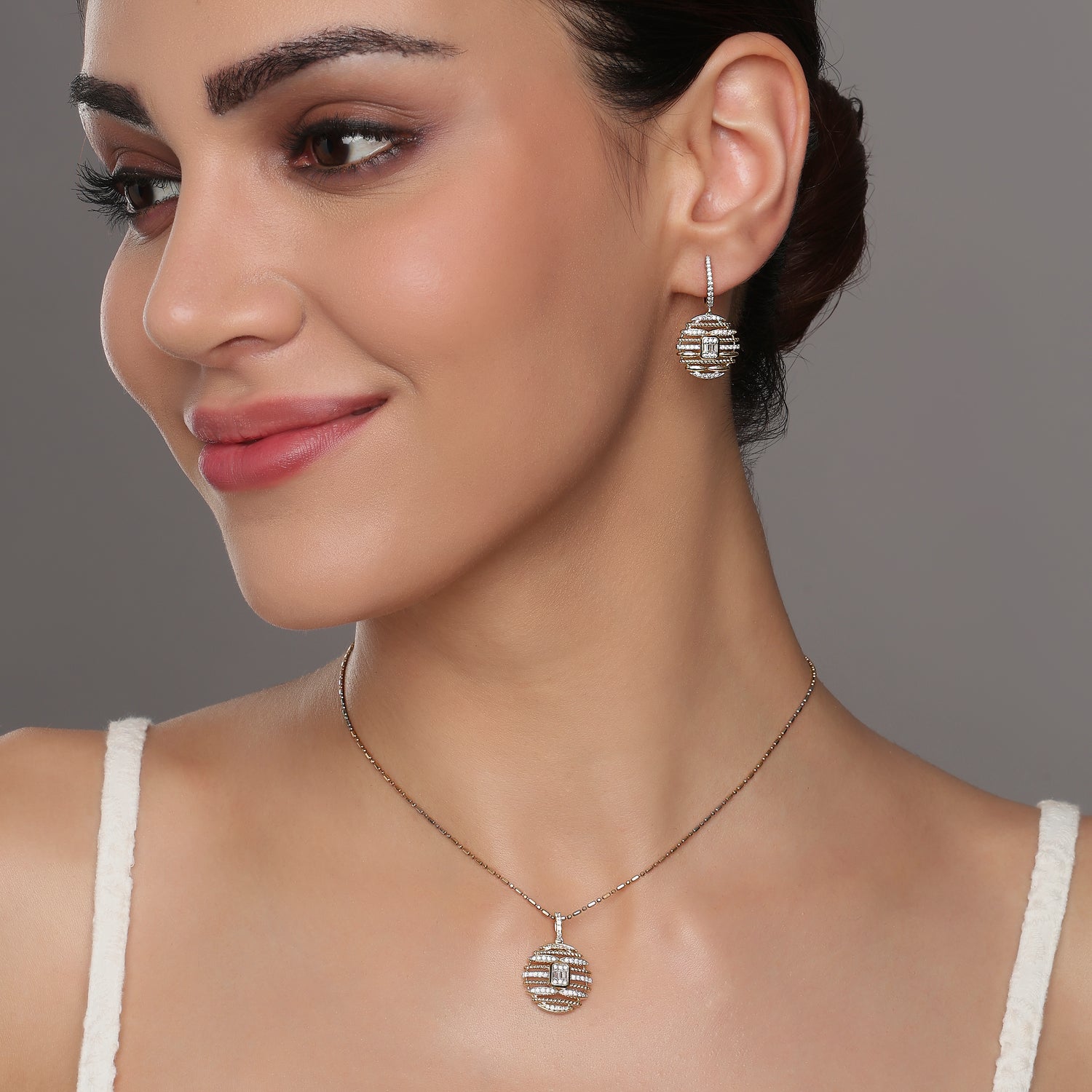 Radiant Celestial Symphony Pendant and Drop Earring Set in an Ornate Geometric Web Design