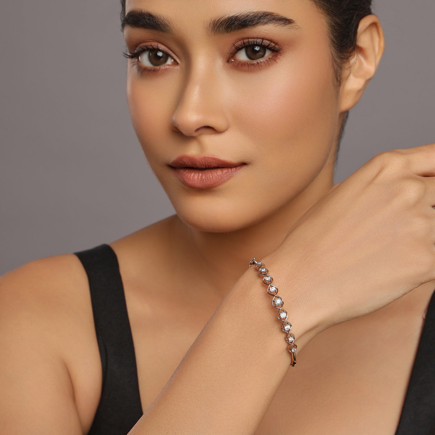 Delicate Infinity Motif Bangle with Sparkling Stone Accents