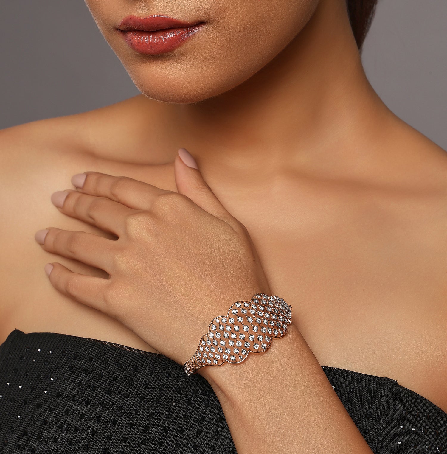 Radiant Wave-Pattern Bangle with Intricate Stone Detailing