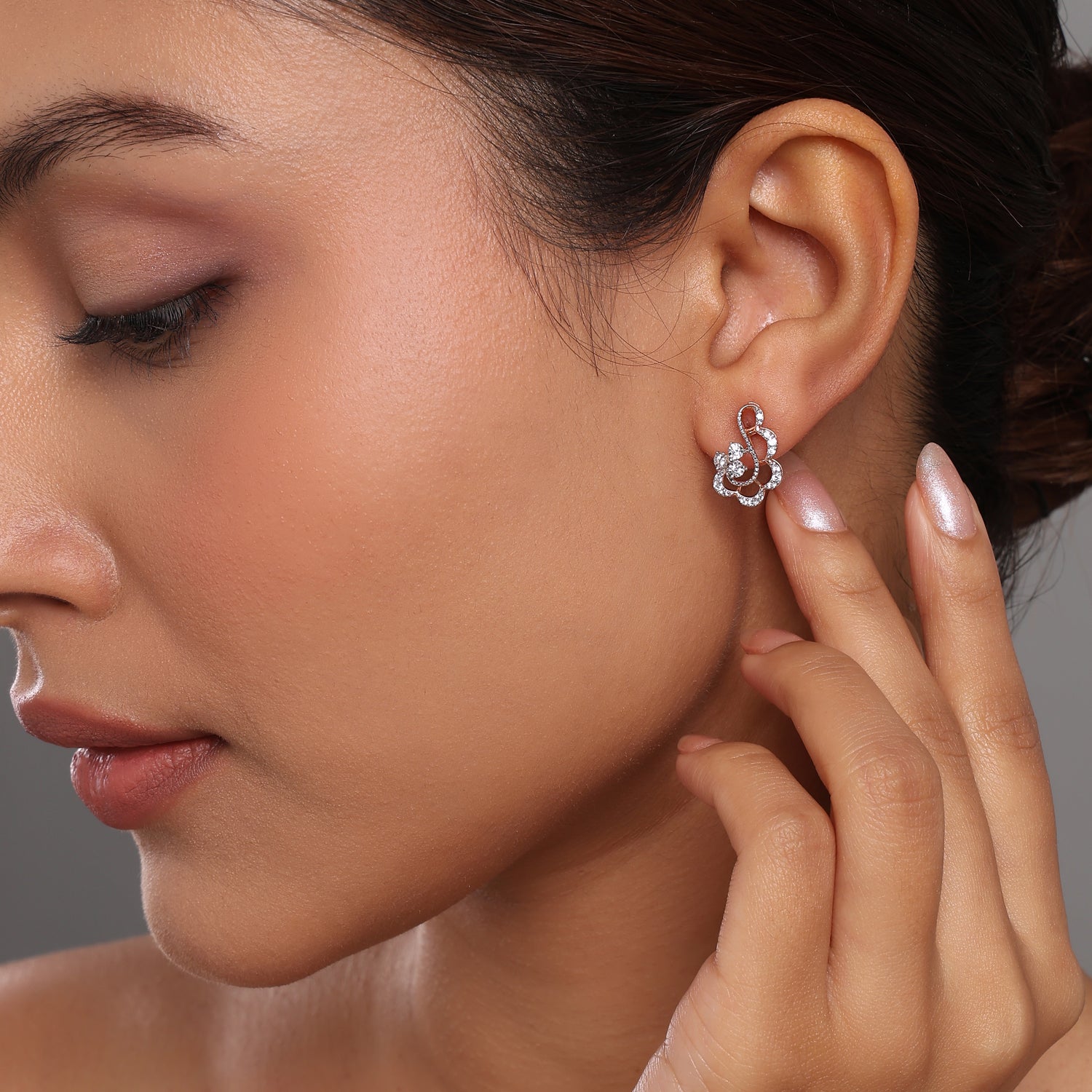 raceful Floral Swirl Stud Earrings with Sparkling Detailing