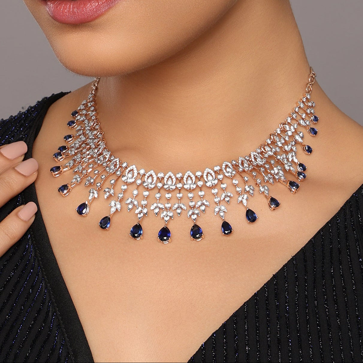 Layered Necklace with Teardrop Accents and Intricate Detailing