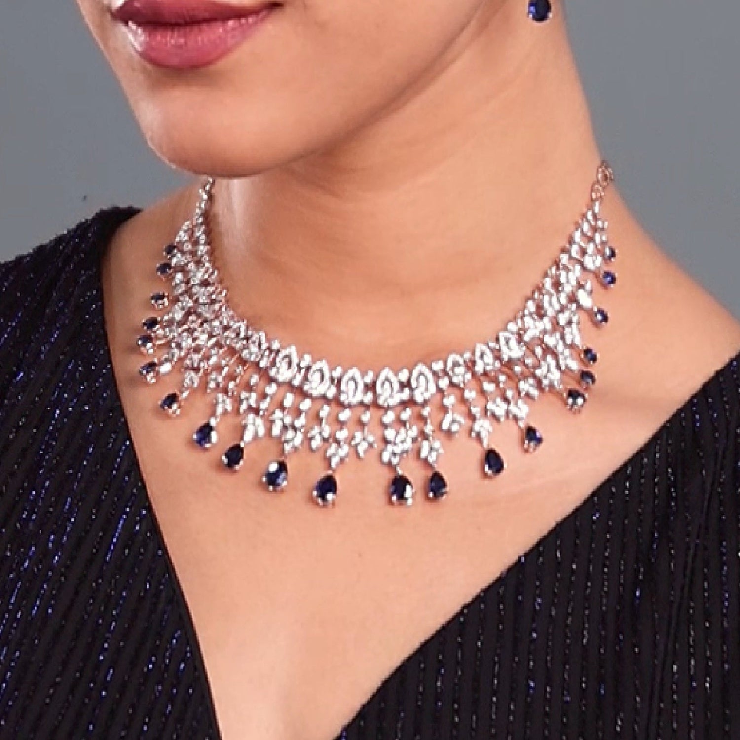 Layered Necklace with Teardrop Accents and Intricate Detailing