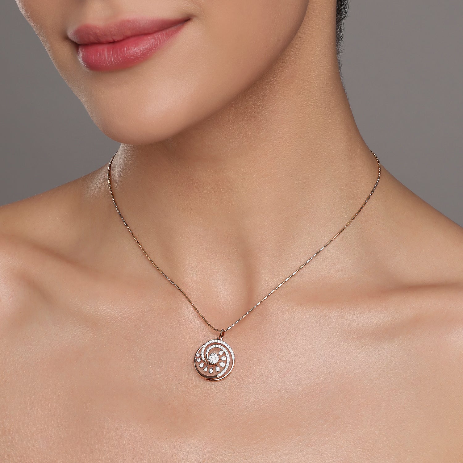 Spiral Pendant with Radiant Circular Detailing