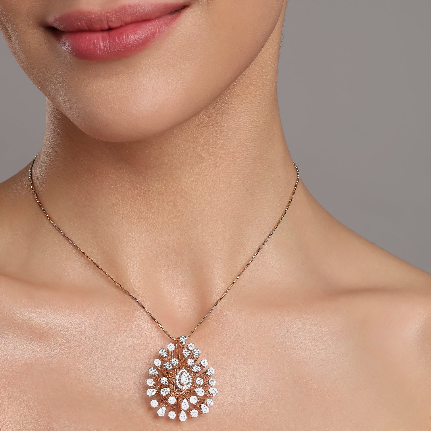 Radiant Sunburst Pendant with Teardrop Center and Layered Design