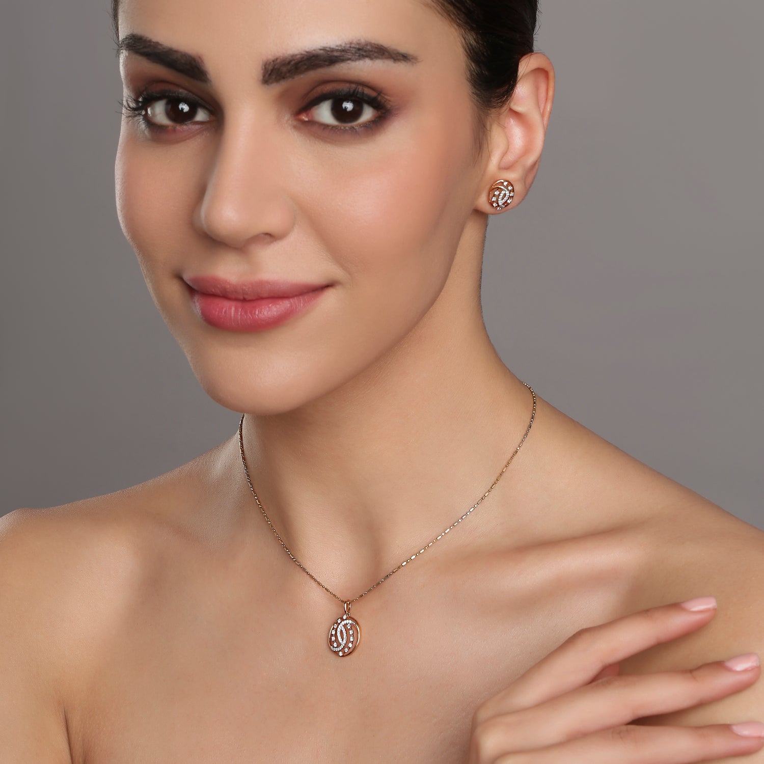 Elegant Swirling Infinity Motif Pendant and Stud Earrings Jewelry Set