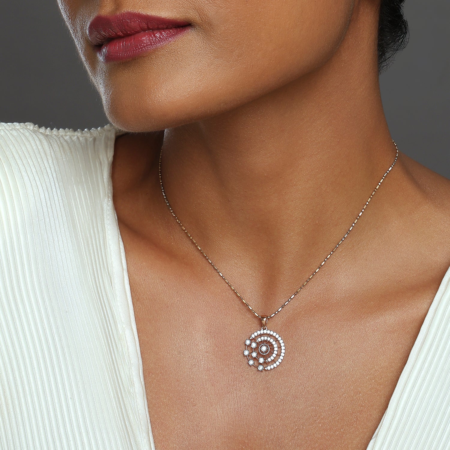 Celestial Spiral Pendant with Starburst Detailing