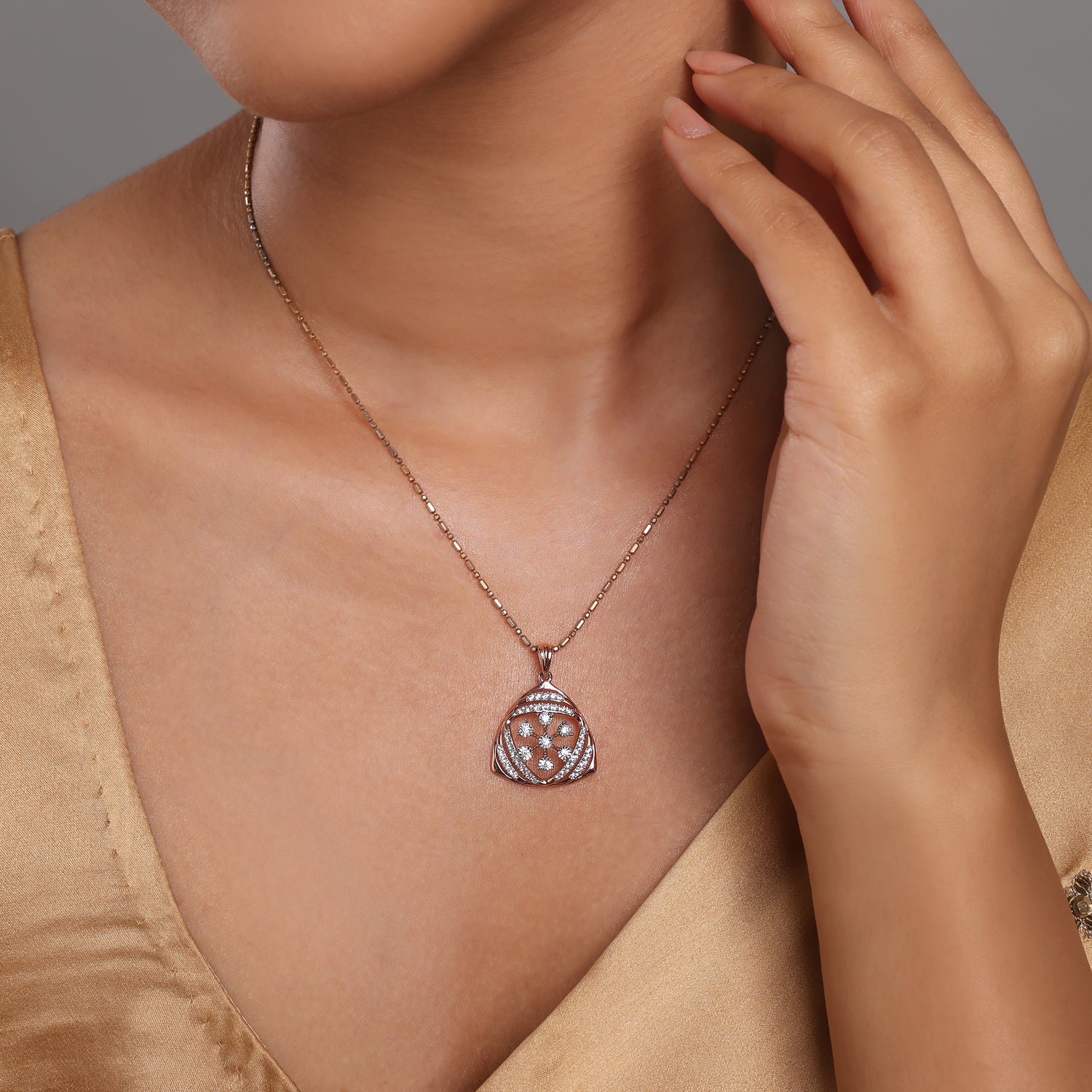 Triangular Floral Pendant with Layered Detailing