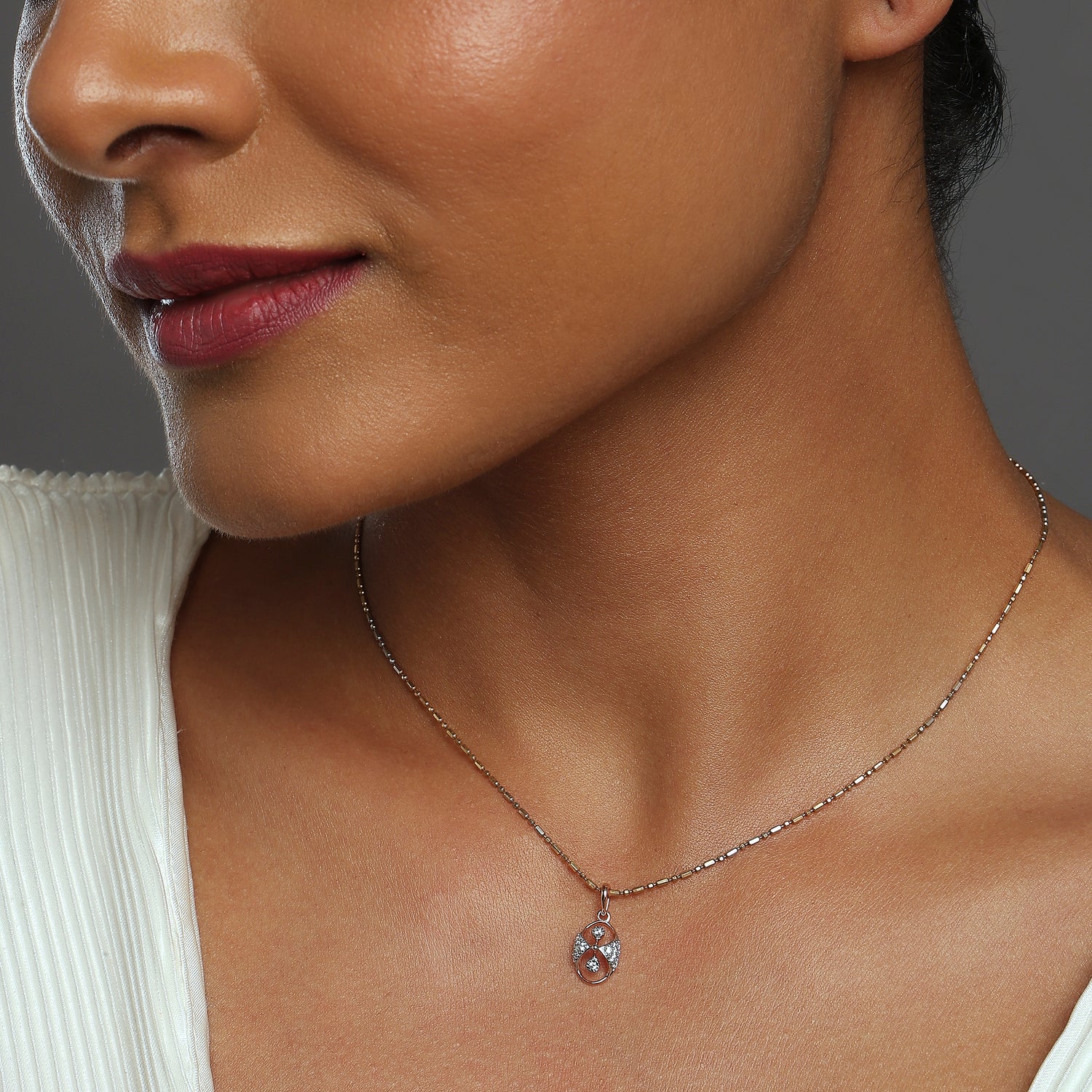 Oval Infinity Pendant with Dual Accent Design