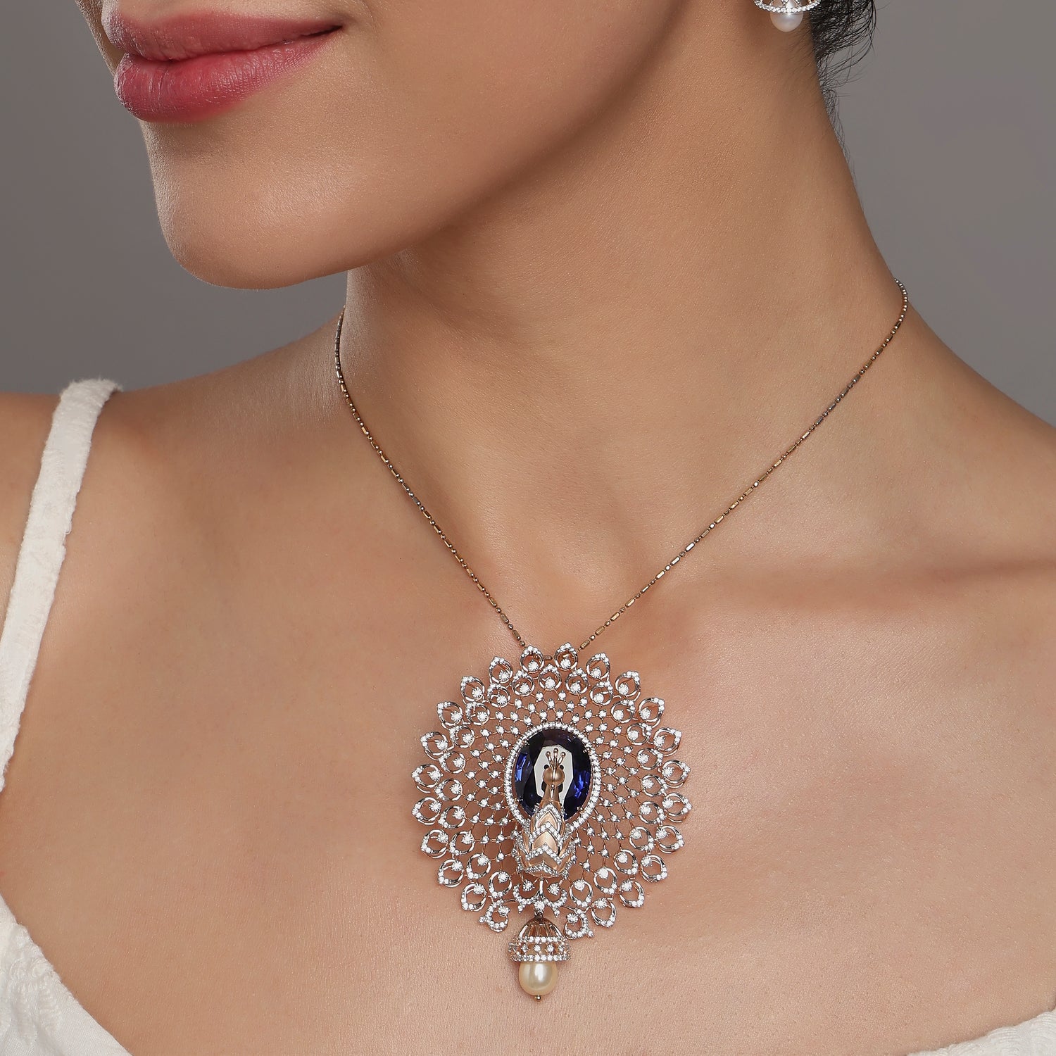 Regal Peacock-Inspired Pendant with Intricate Filigree and Graceful Drop