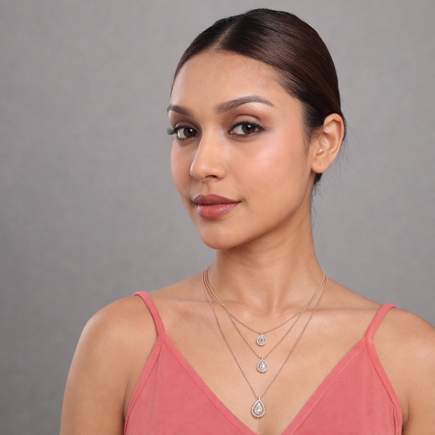 A Luminous Layered Necklace with Cascading Drop Silhouettes