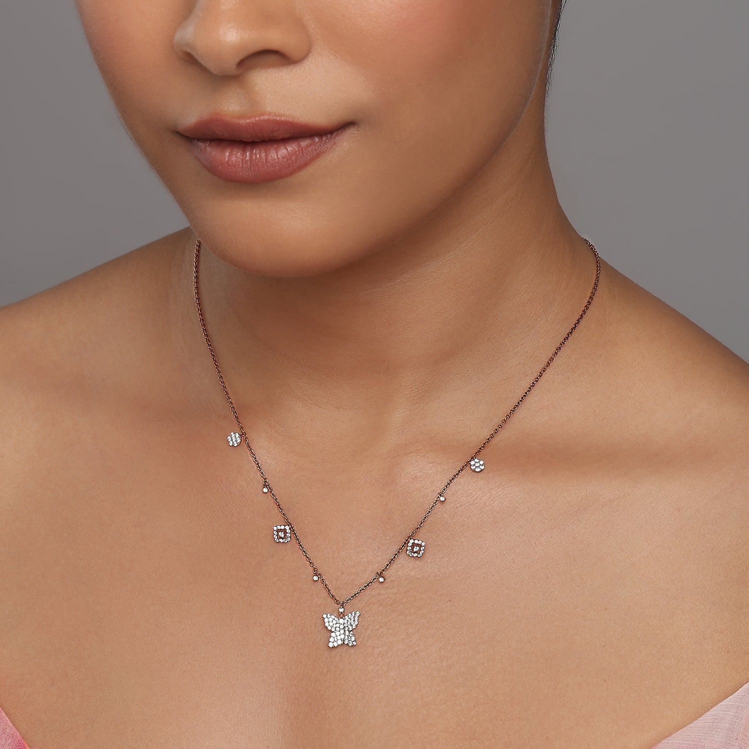 Graceful Butterfly Charm Necklace With Shimmering Floral And Geometric Accents