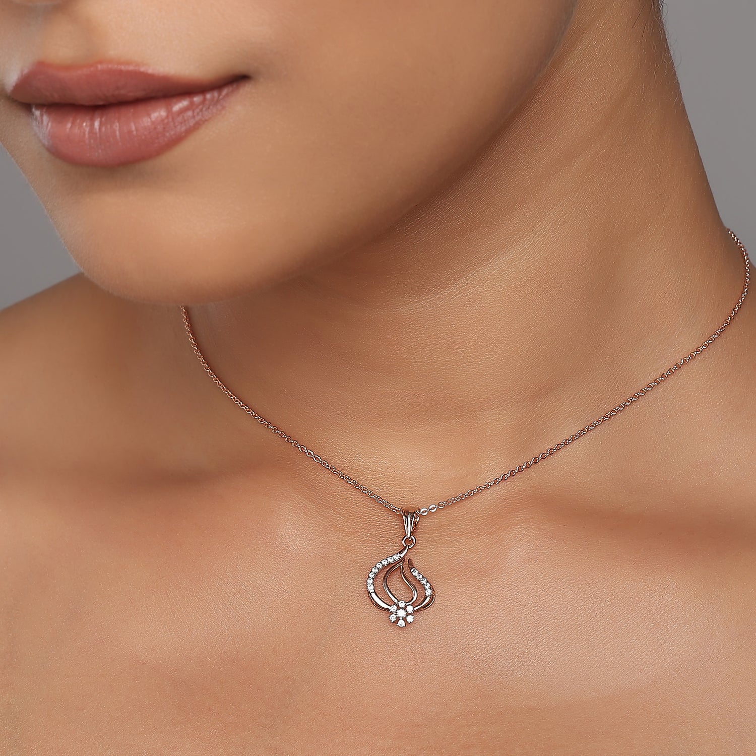 Elegant Curved Teardrop Pendant With Shimmering Floral Cluster Accent