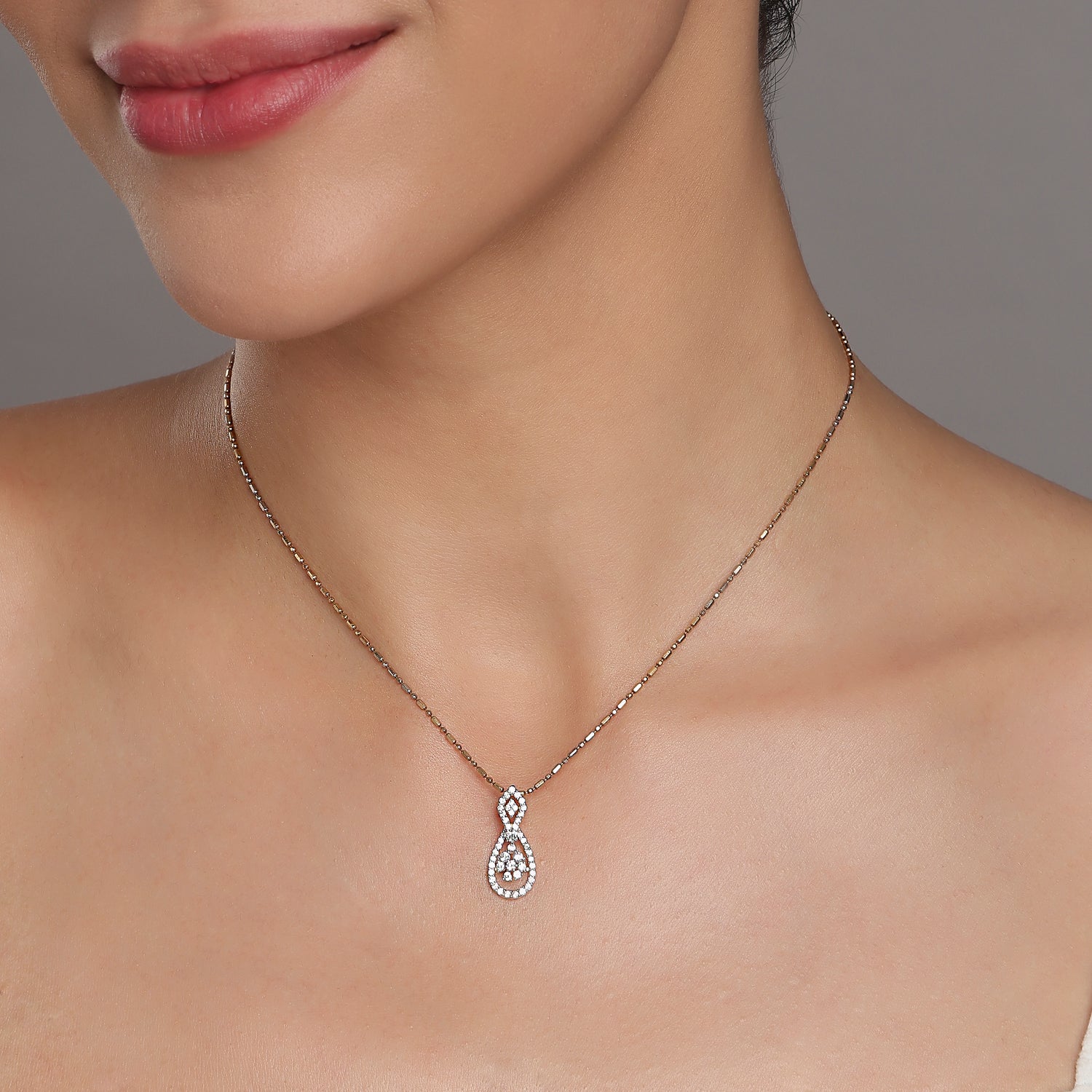 Eternal Teardrop Pendant with Intertwined Open Silhouette