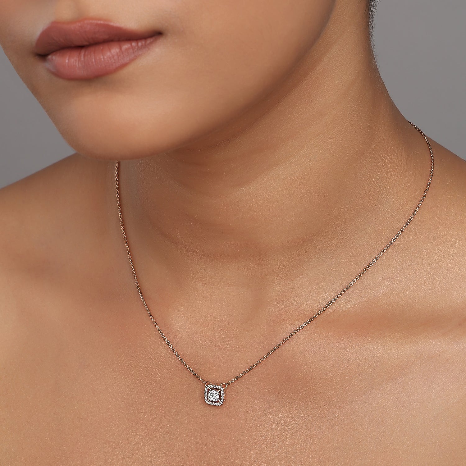 Elegant Circular Cluster Pendant With Radiant Squared Halo Frame