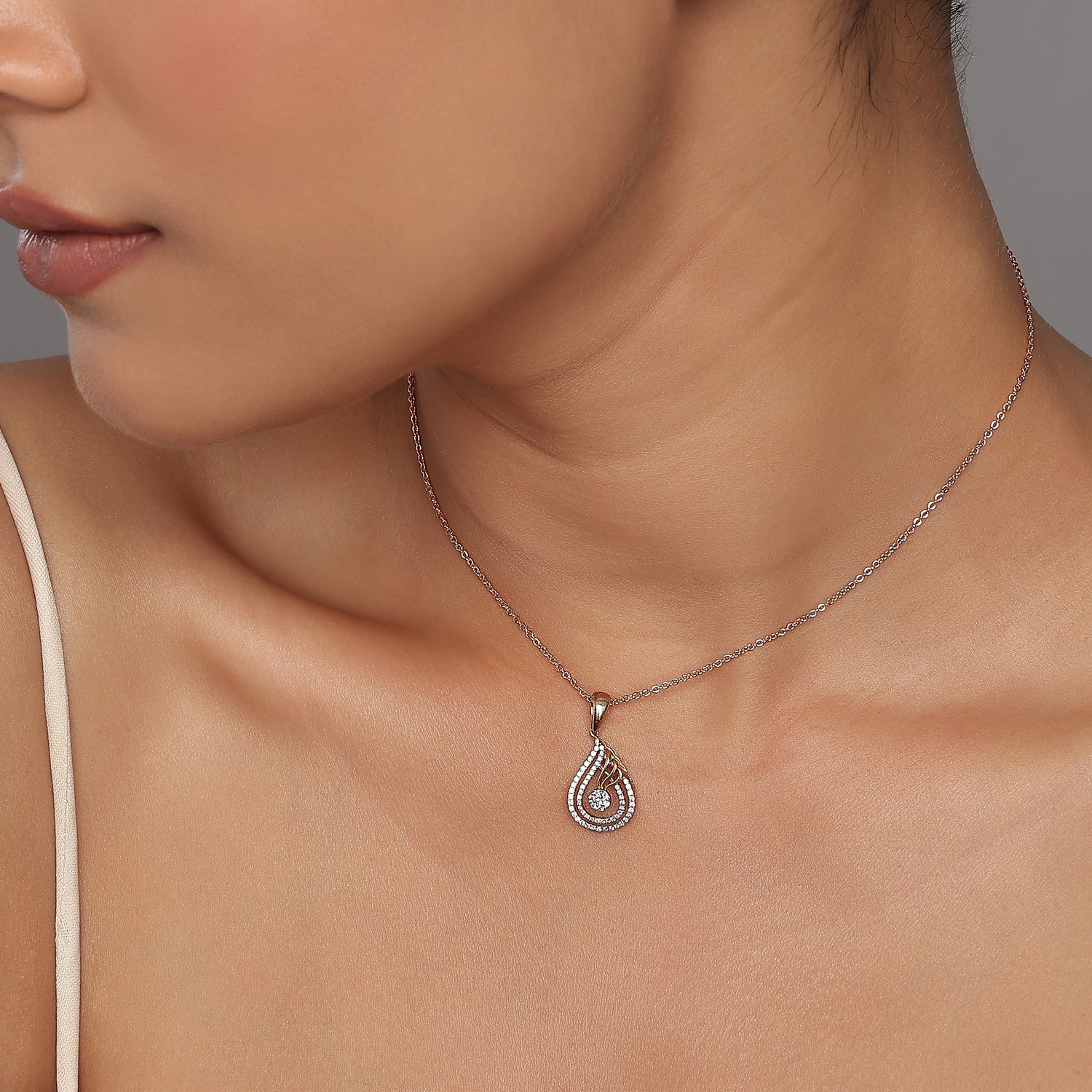 Elegant Openwork Teardrop Pendant With A Shimmering Radiant Cluster Center
