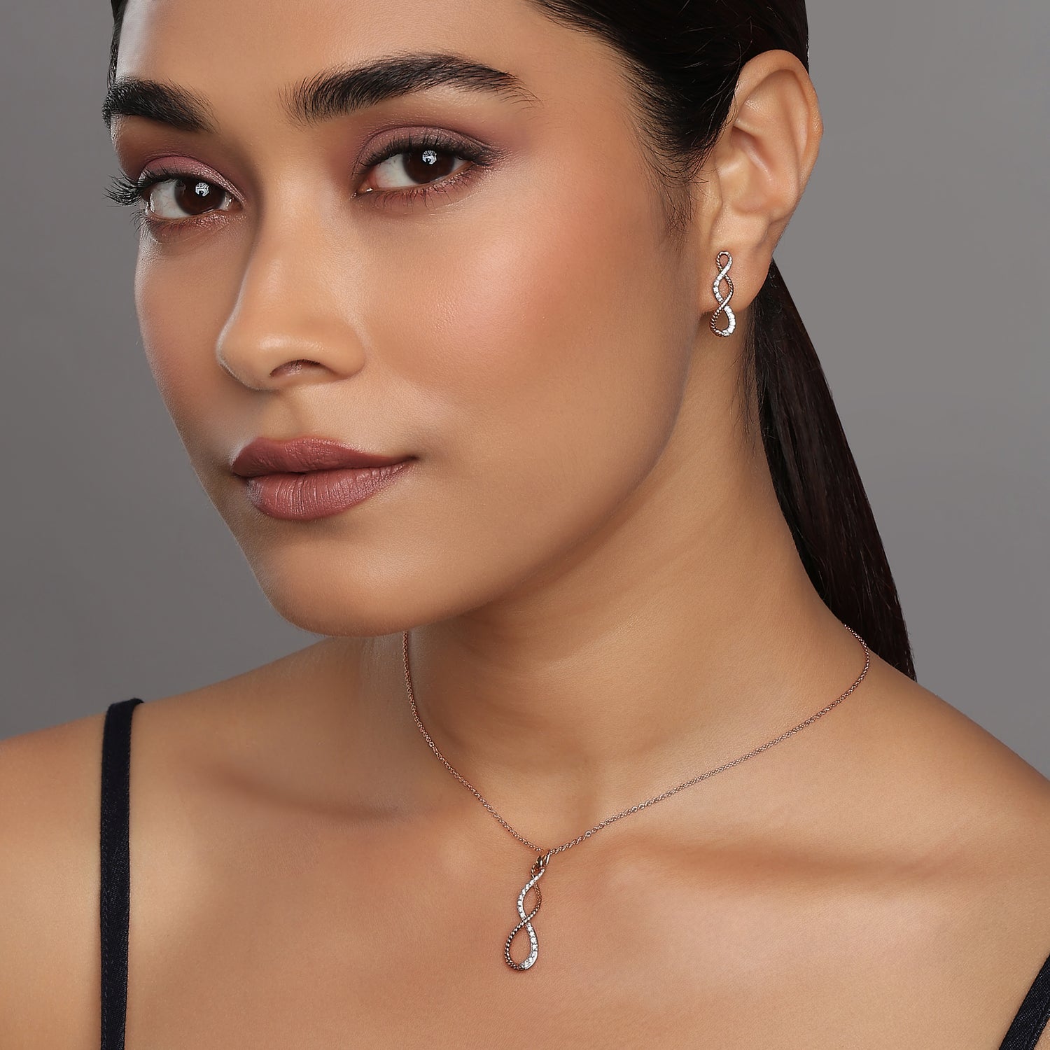 Elegant Twisting Infinite Embrace Pendant and Matching Earring Set