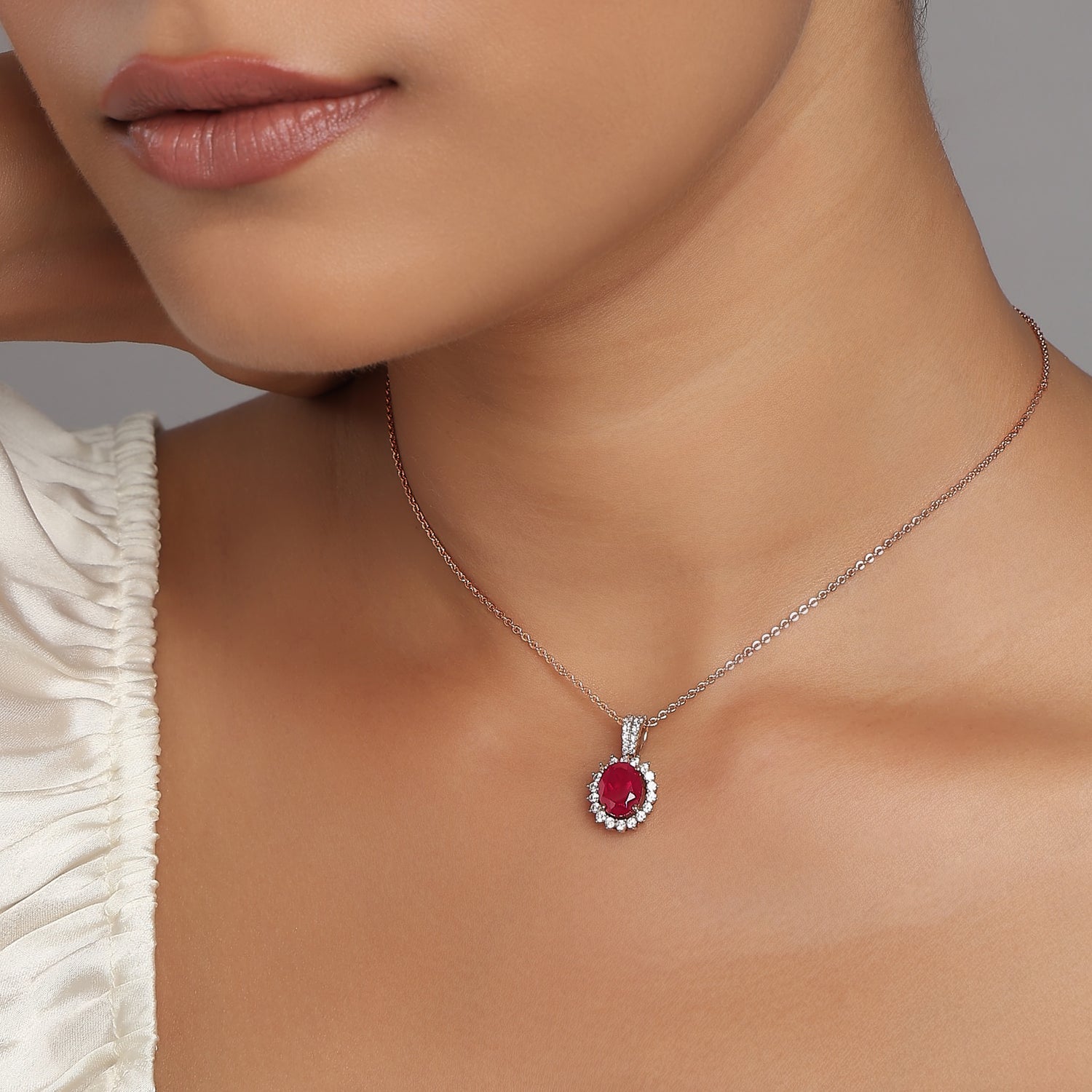 Elegant Oval Crimson Stone Pendant Surrounded by Radiant Floral Halo