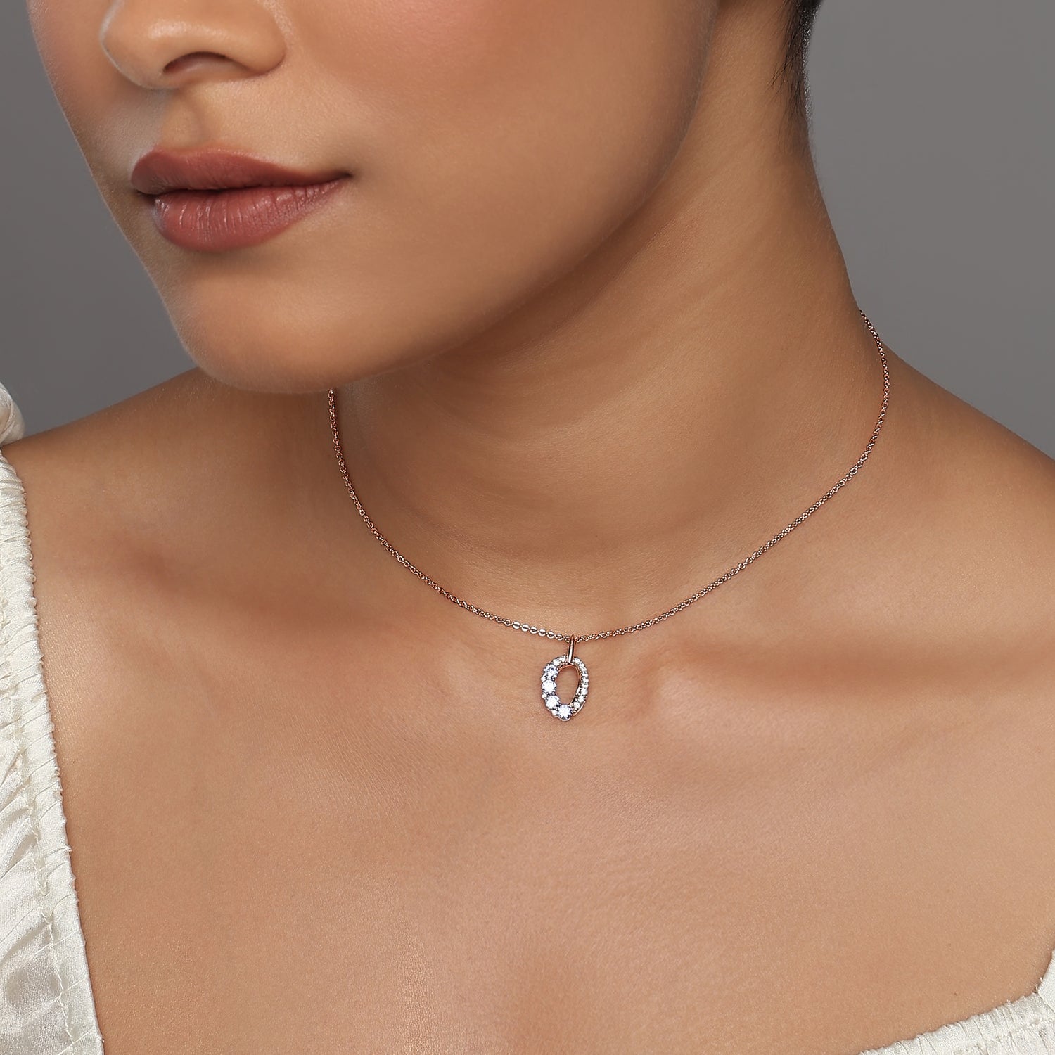 The Celestial Azure Oval Necklace in an Elegant Halo Setting