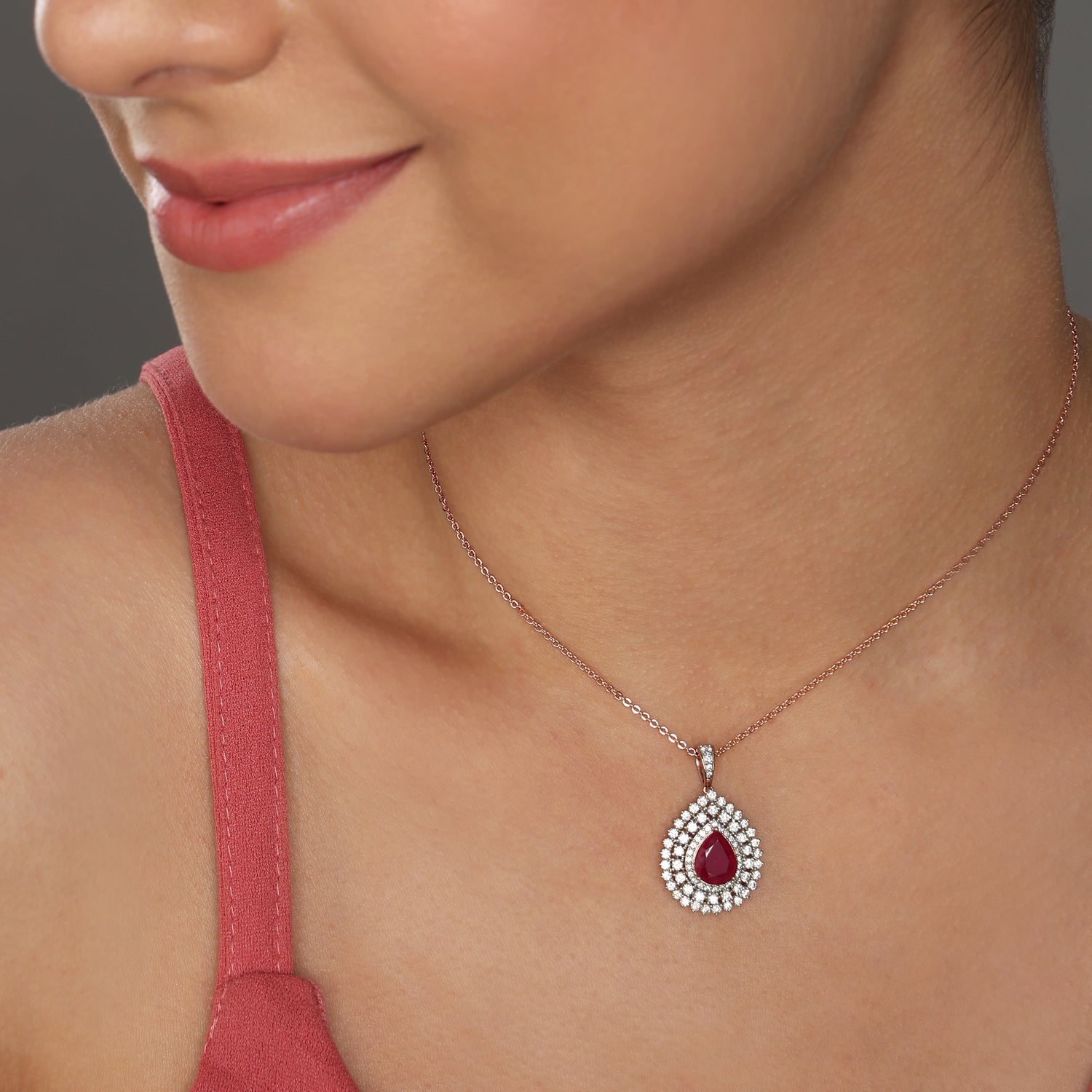 A Radiant Teardrop Halo Pendant with Graceful Allure