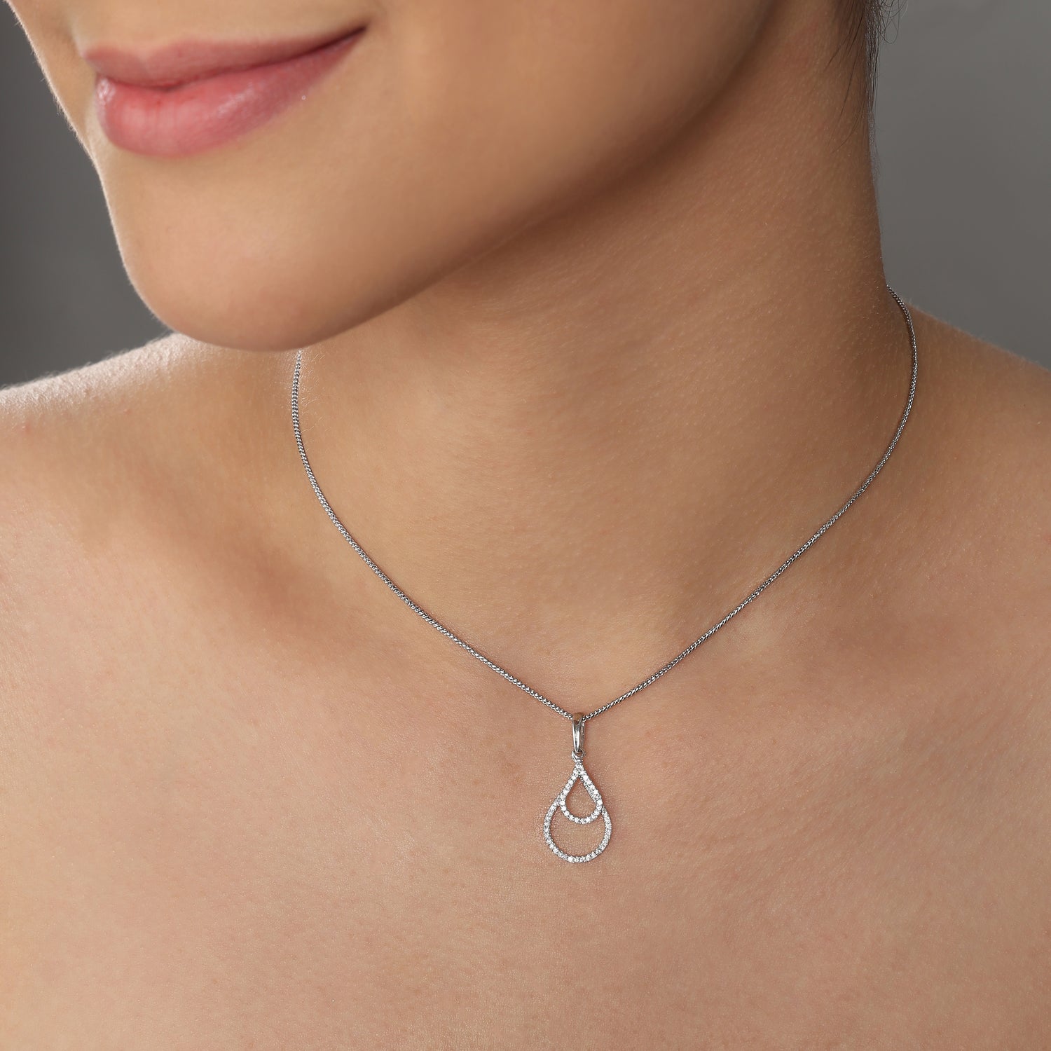 Graceful Teardrop Pendant with Layered Openwork Design