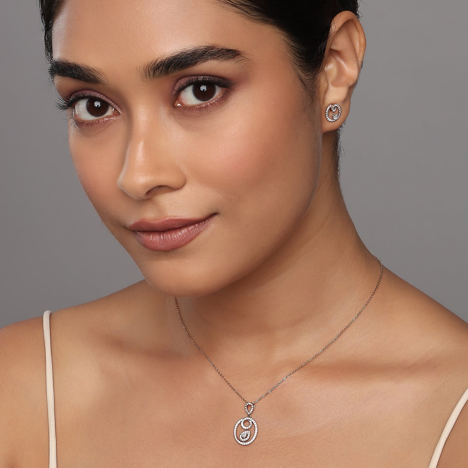 Elegant Rose Hued Eternal Radiance Halo Pendant And Matching Earrings Set